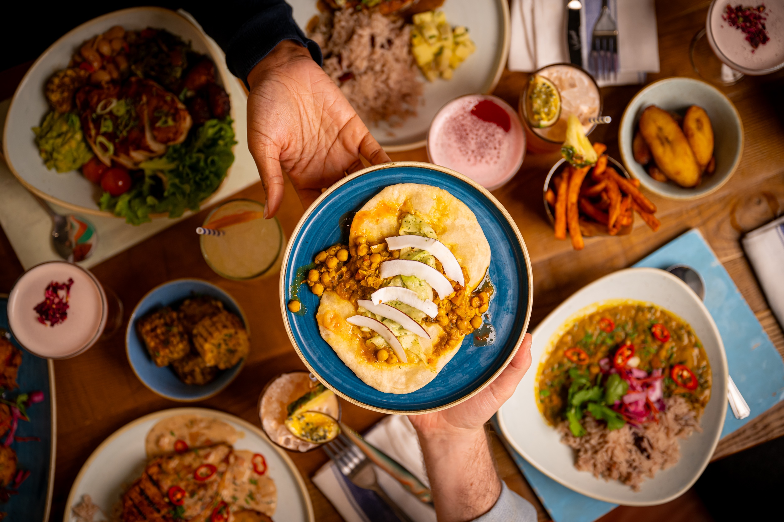 Trini Doubles at Turtle Bay - Passing the plate