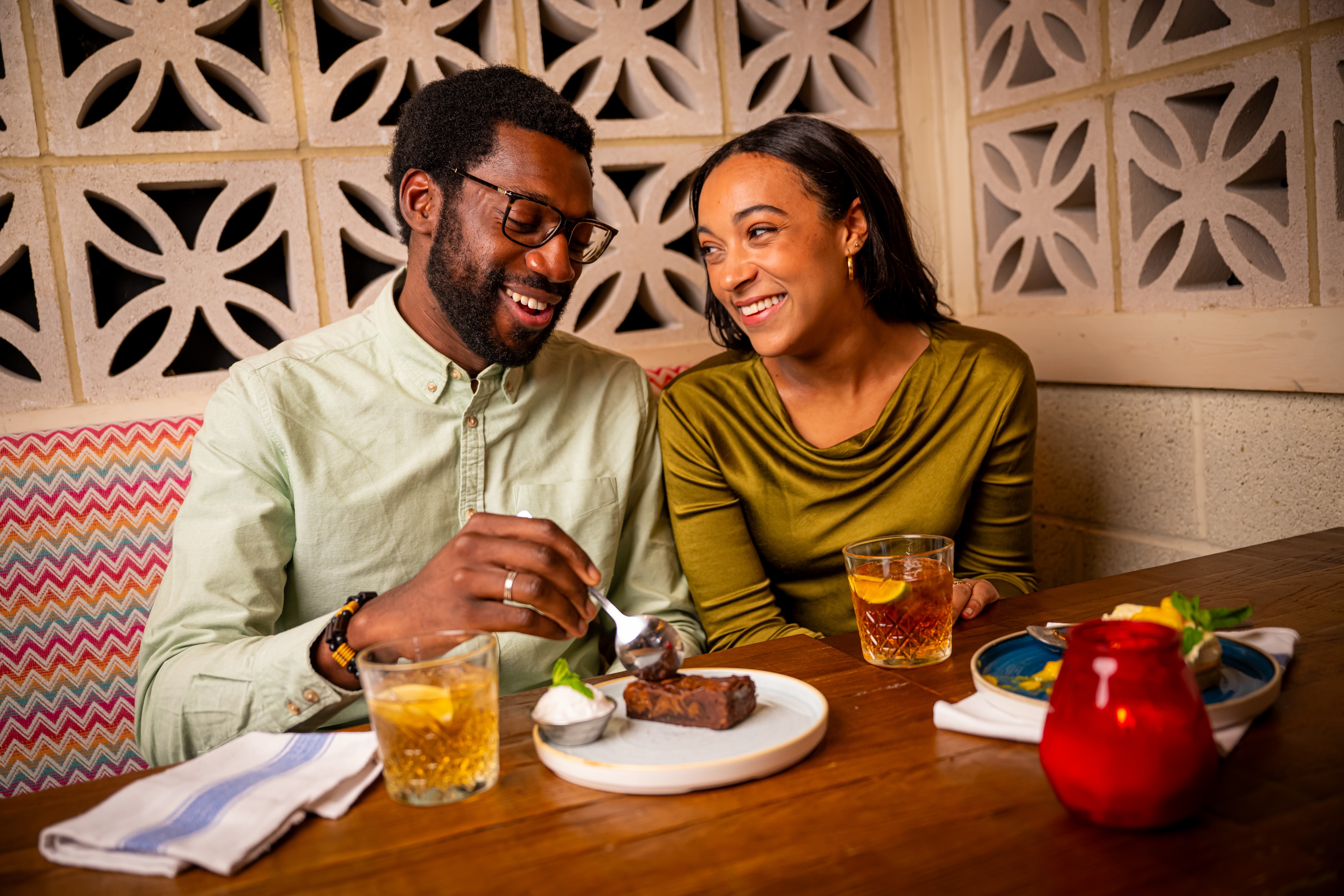 Couple enjoying rum and desserts valentines day
