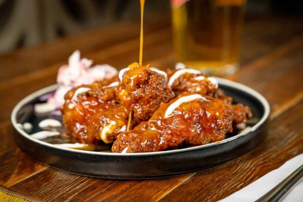 Crispy chicken wings in sticky rum bbq sauce